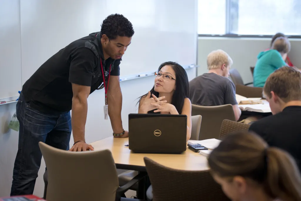 Excel center tutor working with a student during office hours